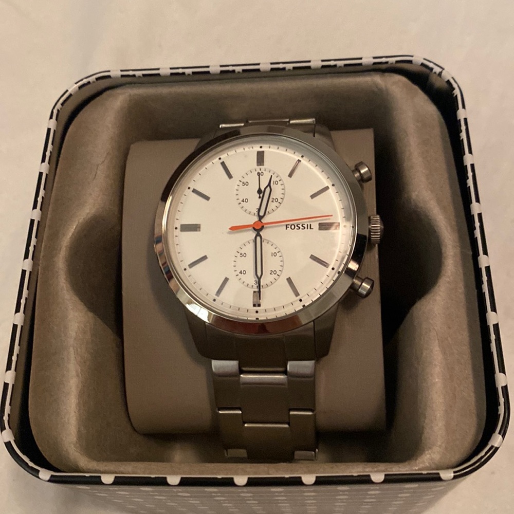 Men watch Fossil